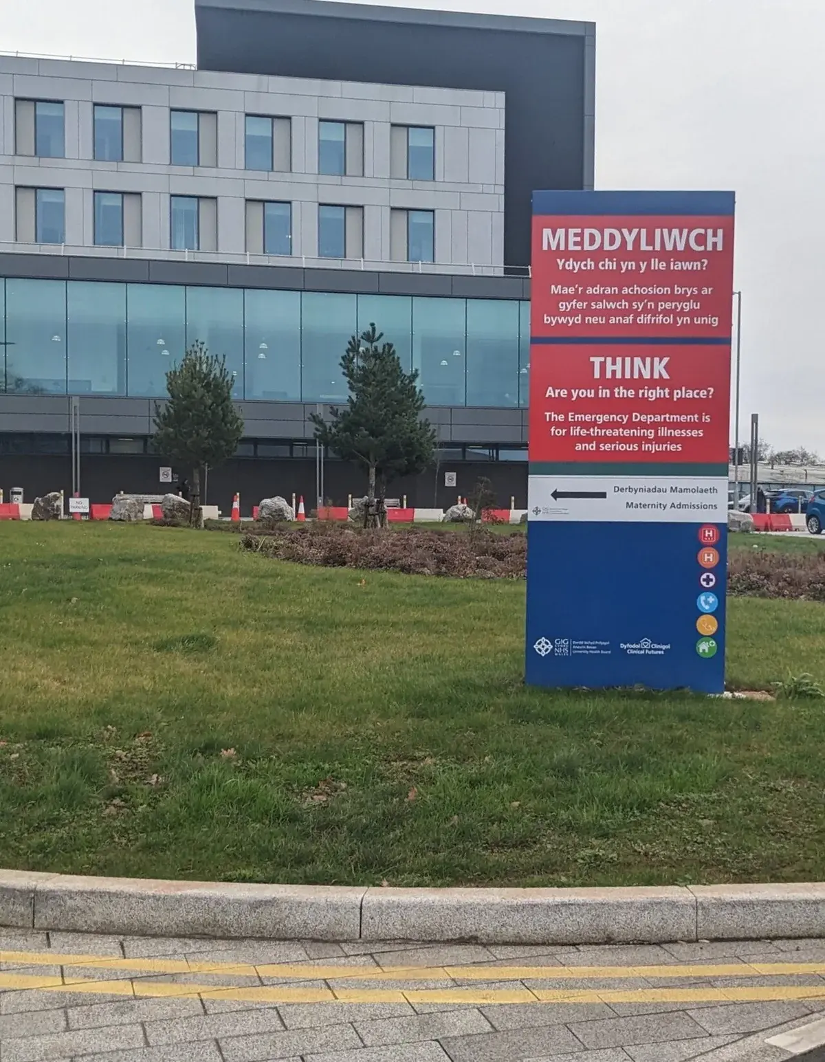 A large hospital direction sign outside Grange University Hospital.